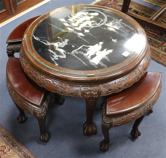 A carved Chinese table with mother-of-pearl inlay and four stools, W.85cm